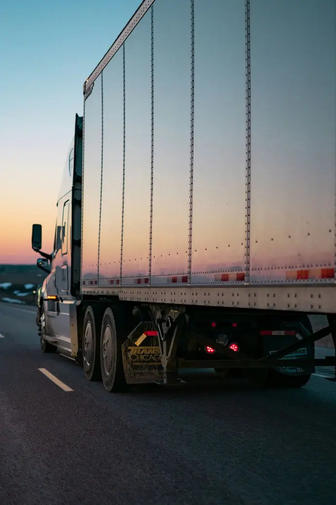 white freight truck on road during daytime